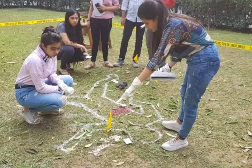 Team marking and documenting a cordoned crime scene